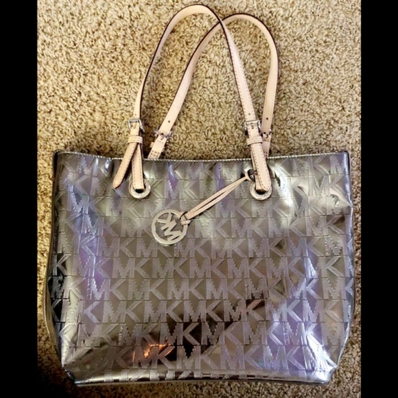 Michael Kors Handbags - Authentic Michael Kors Lg Jet Set Metallic Tote.